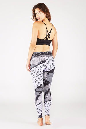 SEA YOGI // Pintuck Bra in Black Sheen colour by Manduka, left-side back image