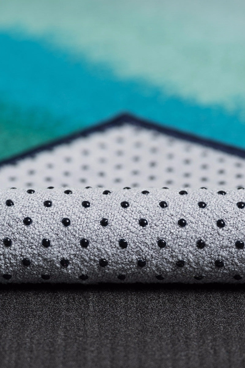 MANDUKA YOGITOES SKIDLESS MAT TOWEL WATERFALL OCEANA STYLE AND CLOSE UP FABRIC IMAGE