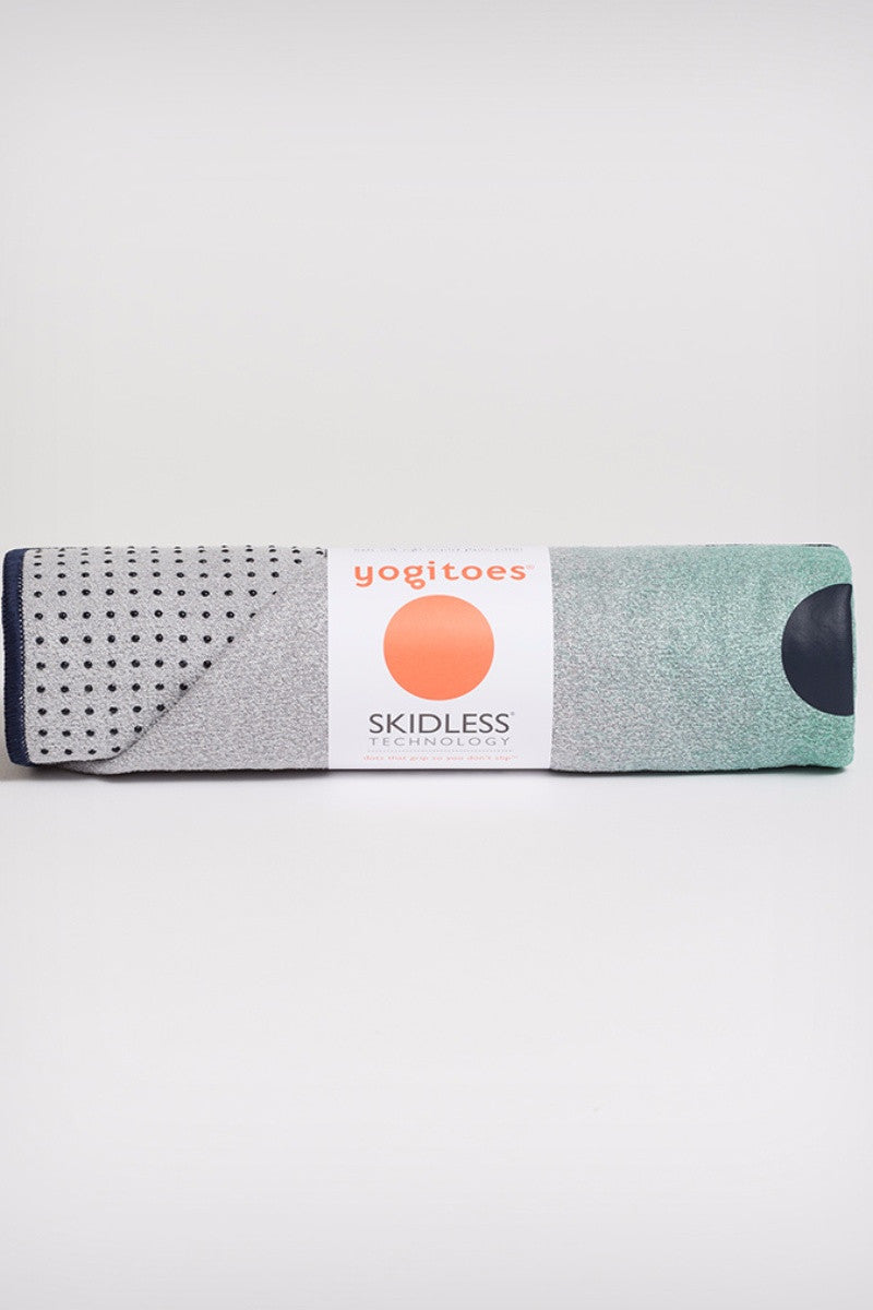 MANDUKA YOGITOES SKIDLESS MAT TOWEL WATERFALL OCEANA STYLE AND ROLLED UP IMAGE